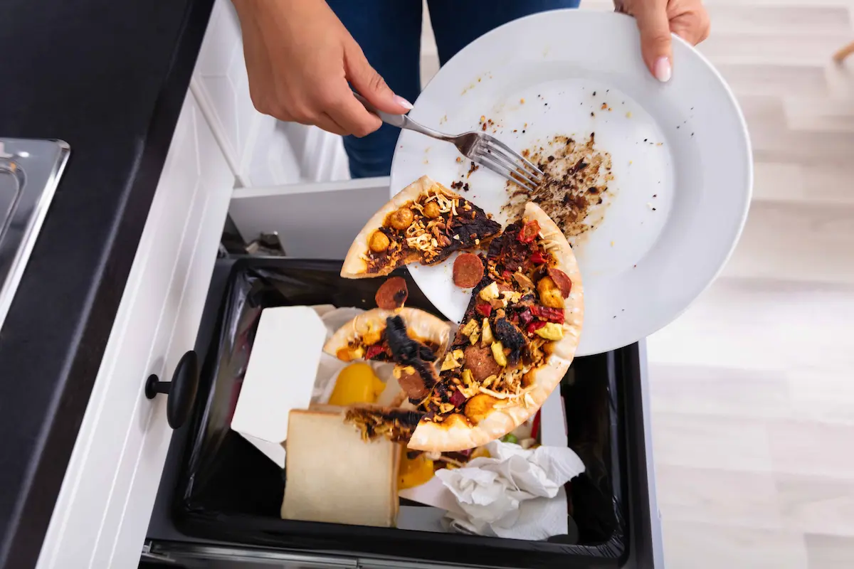 Throwing leftover food into trash which can attract pests indoors