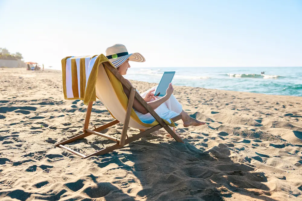 woman reading in beach chair